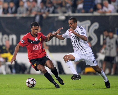 ISTANBUL, TURKEY - SEPTEMBER 15:  Nani of Manchester United is challenged by Mert Nobre of Besitkas during the UEFA Champions League Group B match between Besiktas and Manchester United at the Inonu Stadium on September 15, 2009 in Istanbul, Turkey.  <br /><br /><span class="help">(Photo by Shaun Botterill/Getty Images)</span>