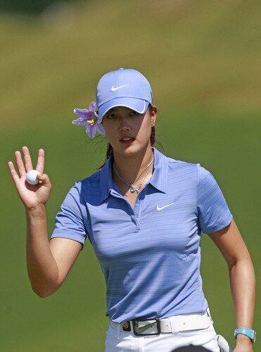PRATTVILLE, AL - OCTOBER 1:  Michelle Wie waves after completing her first round play on the ninth hole during the Navistar LPGA Classic at the Robert Trent Jones Golf Trail at Capitol Hill on October 1, 2009 in  Prattville, Alabama.  <br /><br /><span class="help">(Photo by Dave Martin/Getty Images)</span>