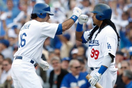 LOS ANGELES, CA - OCTOBER 08:  (L-R) Andre Ethier #16 of the Los Angeles Dodgers celebrates with Manny Ramirez #99 after Ethier hit a solo home run to center in the fourth inning against the St. Louis Cardinals in Game Two of the NLDS during the 2009 MLB Playoffs at Dodger Stadium on October 8, 2009 in Los Angeles, California.  <br /><br /><span class="help">(Photo by Jeff Gross/Getty Images)</span>