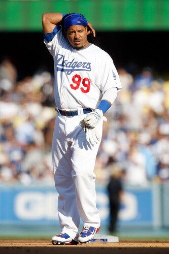 LOS ANGELES, CA - OCTOBER 08:  Manny Ramirez #99 of the Los Angeles Dodgers fixes his hair after grounding out to first base against the St. Louis Cardinals in Game Two of the NLDS during the 2009 MLB Playoffs at Dodger Stadium on October 8, 2009 in Los Angeles, California.  <br /><br /><span class="help">(Photo by Jeff Gross/Getty Images)</span>