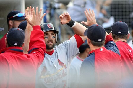 LOS ANGELES, CA - OCTOBER 08:  Mark DeRosa #7 of the St. Louis Cardinals celebrates in the dugout with teammates after scoring a run on a Colby Rasmus #28 double in the seventh inning against the Los Angeles Dodgers in Game Two of the NLDS during the 2009 MLB Playoffs at Dodger Stadium on October 8, 2009 in Los Angeles, California.  <br /><br /><span class="help">(Photo by Stephen Dunn/Getty Images)</span>