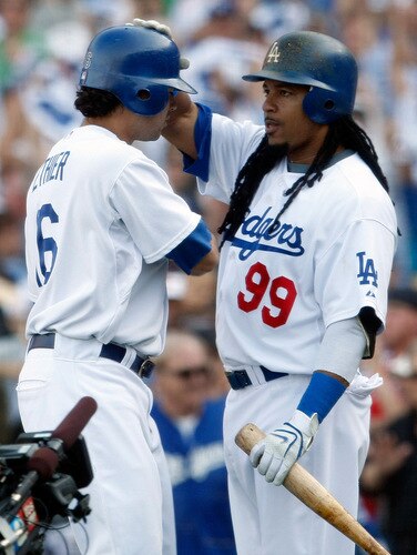 LOS ANGELES, CA - OCTOBER 08:  (L-R) Andre Ethier #16 of the Los Angeles Dodgers celebrates with Manny Ramirez #99 after Ethier hit a solo home run to center in the fourth inning against the St. Louis Cardinals in Game Two of the NLDS during the 2009 MLB Playoffs at Dodger Stadium on October 8, 2009 in Los Angeles, California.  <br /><br /><span class="help">(Photo by Jeff Gross/Getty Images)</span>
