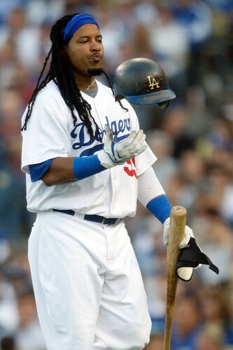 LOS ANGELES, CA - OCTOBER 08:  Manny Ramirez #99 of the Los Angeles Dodgers reacts after striking out in the seventh inning against the St. Louis Cardinals in Game Two of the NLDS during the 2009 MLB Playoffs at Dodger Stadium on October 8, 2009 in Los Angeles, California.  <br /><br /><span class="help">(Photo by Jeff Gross/Getty Images)</span>