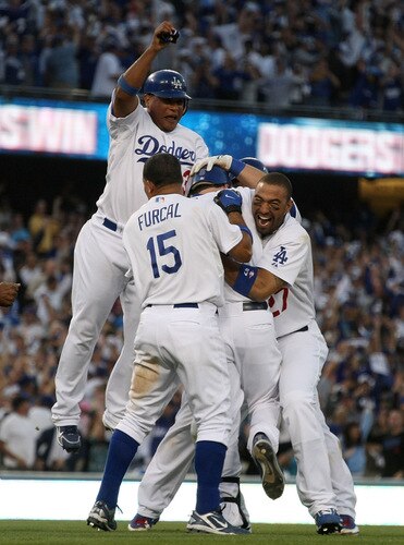 LOS ANGELES, CA - OCTOBER 08:  (L-R) Ronnie Belliard #3, Rafael Furcal #15, Mark Loretta #5 and Matt Kemp #27 of the Los Angeles Dodgers celebrate after Loretta hit a walk-off RBI to defeat the St. Louis Cardinals in Game Two of the NLDS during the 2009 MLB Playoffs at Dodger Stadium on October 8, 2009 in Los Angeles, California. The Dodgers defeated the Cardinals 3-2 to take a 2-0 series lead.  <br /><br /><span class="help">(Photo by Stephen Dunn/Getty Images)</span>