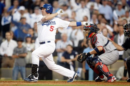LOS ANGELES, CA - OCTOBER 08:  Mark Loretta #5 of the Los Angeles Dodgers hits a walk-off RBI single to center to score Casey Blake #23 to defeat the St. Louis Cardinals in Game Two of the NLDS during the 2009 MLB Playoffs at Dodger Stadium on October 8, 2009 in Los Angeles, California. The Dodgers defeated the Cardinals 3-2 to take a 2-0 series lead.  <br /><br /><span class="help">(Photo by Jeff Gross/Getty Images)</span>