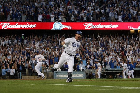 LOS ANGELES, CA - OCTOBER 08:  Mark Loretta #5 of the Los Angeles Dodgers rounds first as he hits a walk-off RBI single to center to score Casey Blake #23 to defeat the St. Louis Cardinals in Game Two of the NLDS during the 2009 MLB Playoffs at Dodger Stadium on October 8, 2009 in Los Angeles, California. The Dodgers defeated the Cardinals 3-2 to take a 2-0 series lead.  <br /><br /><span class="help">(Photo by Stephen Dunn/Getty Images)</span>
