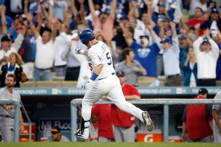 LOS ANGELES, CA - OCTOBER 08:  Mark Loretta #5 of the Los Angeles Dodgers rounds first as he hits a walk-off RBI single to center to score Casey Blake #23 to defeat the St. Louis Cardinals in Game Two of the NLDS during the 2009 MLB Playoffs at Dodger Stadium on October 8, 2009 in Los Angeles, California. The Dodgers defeated the Cardinals 3-2 to take a 2-0 series lead.  <br /><br /><span class="help">(Photo by Jeff Gross/Getty Images)</span>