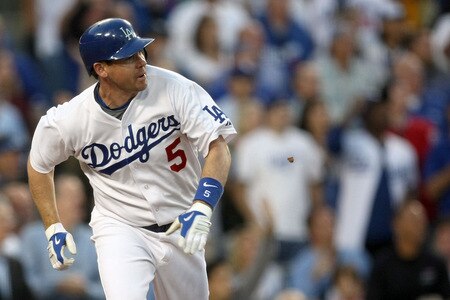 LOS ANGELES, CA - OCTOBER 08:  Mark Loretta #5 of the Los Angeles Dodgers hits a walk-off RBI single to center to score Casey Blake #23 to defeat the St. Louis Cardinals in Game Two of the NLDS during the 2009 MLB Playoffs at Dodger Stadium on October 8, 2009 in Los Angeles, California. The Dodgers defeated the Cardinals 3-2 to take a 2-0 series lead.  <br /><br /><span class="help">(Photo by Stephen Dunn/Getty Images)</span>