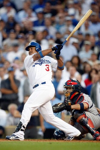 LOS ANGELES, CA - OCTOBER 08:  Ronnie Belliard #3 of the Los Angeles Dodgers singles to center scoring Juan Pierre #9 to tie the game in the ninth inning against the St. Louis Cardinals in Game Two of the NLDS during the 2009 MLB Playoffs at Dodger Stadium on October 8, 2009 in Los Angeles, California. The Dodgers defeated the Cardinals 3-2 to take a 2-0 series lead.  <br /><br /><span class="help">(Photo by Jeff Gross/Getty Images)</span>