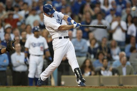 LOS ANGELES, CA - OCTOBER 08:  Mark Loretta #5 of the Los Angeles Dodgers hits a walk-off RBI single to center to score Casey Blake #23 to defeat the St. Louis Cardinals in Game Two of the NLDS during the 2009 MLB Playoffs at Dodger Stadium on October 8, 2009 in Los Angeles, California. The Dodgers defeated the Cardinals 3-2 to take a 2-0 series lead.  <br /><br /><span class="help">(Photo by Stephen Dunn/Getty Images)</span>