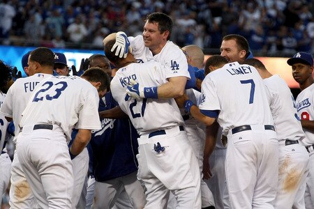 LOS ANGELES, CA - OCTOBER 08:  (M) Mark Loretta #5 is picked up by Matt Kemp #27 of the Los Angeles Dodgers as they celebrate after Loretta hit a walk-off RBI to defeat the St. Louis Cardinals in Game Two of the NLDS during the 2009 MLB Playoffs at Dodger Stadium on October 8, 2009 in Los Angeles, California. The Dodgers defeated the Cardinals 3-2 to take a 2-0 series lead.  <br /><br /><span class="help">(Photo by Stephen Dunn/Getty Images)</span>