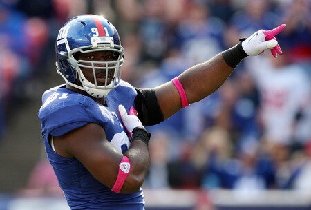 EAST RUTHERFORD, NJ - OCTOBER 11:  Justin Tuck #91 of the New York Giants celebrates his sack in the third quarter against the Oakland Raiders on October 11, 2009 at Giants Stadium in East Rutherford, New Jersey. The Giants defeated the Raiders 44-7.  <br /><br /><span class="help">(Photo by Jim McIsaac/Getty Images)</span>