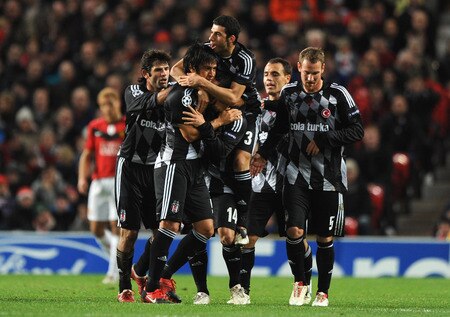MANCHESTER, ENGLAND - NOVEMBER 25:  Rodrigo Tello of Besiktas is mobbed by his team mates after scoring the opening goal during the UEFA Champions League Group B match between Manchester United and Besiktas at Old Trafford on November 25, 2009 in Manchester, England.  <br /><br /><span class="help">(Photo by Laurence Griffiths/Getty Images)</span>