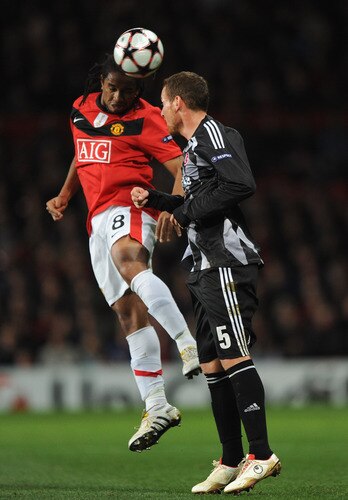MANCHESTER, UNITED KINGDOM - NOVEMBER 25: Michael Fink of Besiktas competes for the ball with Anderson of Manchester United during the UEFA Champions League Group B match between Manchester United and Besiktas at Old Trafford on November 25, 2009 in Manchester, England. <br /><br /><span class="help">(Photo by Laurence Griffiths/Getty Images)</span>