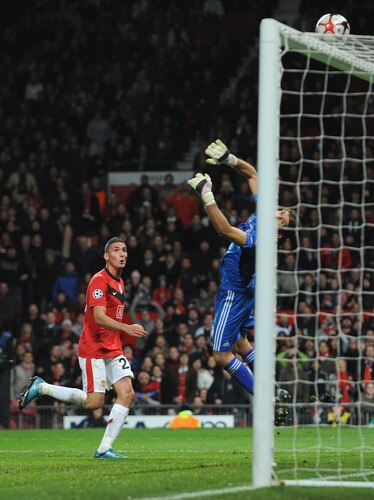 MANCHESTER, ENGLAND - NOVEMBER 25:  Rustu Recber of Besiktas saves the attempt on goal of Federico Macheda of Manchester United during the UEFA Champions League Group B match between Manchester United and Besiktas at Old Trafford on November 25, 2009 in Manchester, England.  <br /><br /><span class="help">(Photo by Laurence Griffiths/Getty Images)</span>