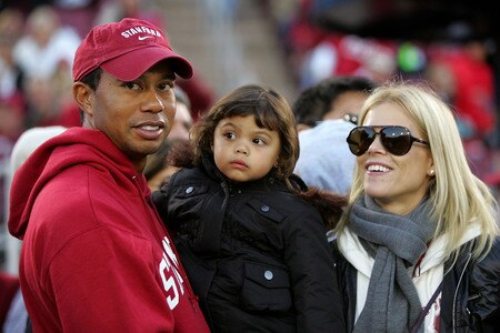 PALO ALTO, CA - NOVEMBER 21:  (FILE PHOTO) Honorary Standford Cardinal captain Tiger Woods holds his daugher, Sam, and stands next to his wife, Elin Nordegren, on the sidelines before the Cardinal game against the California Bears at Stanford Stadium on November 21, 2009 in Palo Alto, California. According to reports December 11, 2009, Woods announced that he would take an indefinite hiatus from golf.   <br /><br /><span class="help">(Photo by Ezra Shaw/Getty Images)</span>