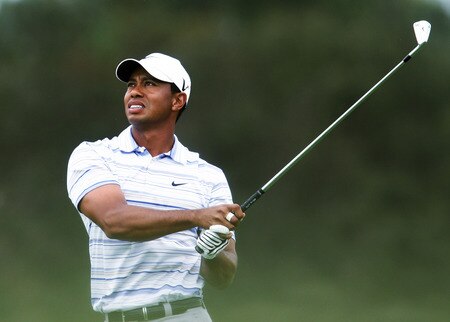 MELBOURNE, AUSTRALIA - NOVEMBER 14:  (FILE PHOTO)  Tiger Woods plays an approach shot on the 4th hole during round three of the 2009 Australian Masters at Kingston Heath Golf Club on November 14, 2009 in Melbourne, Australia. According to reports December 11, 2009, Woods announced that he would take an indefinite hiatus from golf.   <br /><br /><span class="help">(Photo by Quinn Rooney/Getty Images)</span>