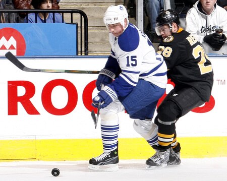 TORONTO - DECEMBER 19:  Tomas Kaberle #15 of the Toronto Maple Leafs gets thr puck from Mark Recchi #28 of the Boston Bruins during game action December 19, 2009 at the Air Canada Centre in Toronto, Ontario, Canada. <br /><br /><span class="help">(Photo by Abelimages/Getty Images)</span>