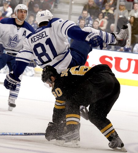 TORONTO - DECEMBER 19:  Phil Kessel #81 of the Toronto Maple Leafs is hit by Vladimir Sobotka #60 of the Boston Bruins during game action December 19, 2009 at the Air Canada Centre in Toronto, Ontario, Canada. <br /><br /><span class="help">(Photo by Abelimages/Getty Images)</span>