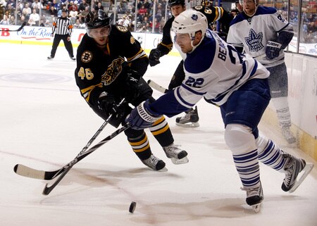 TORONTO - DECEMBER 19:  Francois Beauchemin #22 of the Toronto Maple Leafs battles for the puck with David Krejci #46 of the Boston Bruins during game action December 19, 2009 at the Air Canada Centre in Toronto, Ontario, Canada. <br /><br /><span class="help">(Photo by Abelimages/Getty Images)</span>