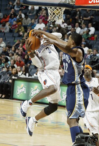 CHARLOTTE, NC - JANUARY 9:  Rudy Gay #22 of the Memphis Grizzlies blocks against Gerald Wallace #3 of the Charlotte Bobcats on January 9, 2010 at the Time Warner Cable Arena in Charlotte, North Carolina.  <br /><br /><span class="help">(Photo by Kent Smith/NBAE via Getty Images)</span>
