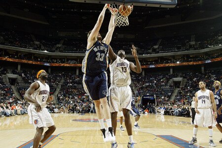 CHARLOTTE, NC - JANUARY 9:  Marc Gasol #33 of the Memphis Grizzlies dunks against Nazr Mohammed #13 of the Charlotte Bobcats on January 9, 2010 at the Time Warner Cable Arena in Charlotte, North Carolina.  <br /><br /><span class="help">(Photo by Kent Smith/NBAE via Getty Images)</span>