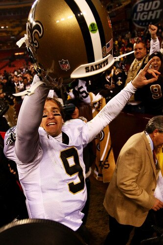 LANDOVER, MD - DECEMBER 06:  (FILE PHOTO) Drew Brees #9 of the New Orleans Saints celebrates victory with fans as he leaves the field after defeating the Washington Redskins on December 6, 2009 at FedExField in Landover, Maryland.  Brees and the Saints will take on the Indianapolis Colts in Super Bowl XLIV on February 7, 2010 in Miami Gardens, Florida.  <br /><br /><span class="help">(Photo by Chris McGrath/Getty Images)</span>
