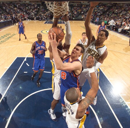 INDIANAPOLIS - APRIL 7: Danilo Gallinari #8 of the New York Knicks battles Danny Granger #33 and Earl Watson #2 of the Indiana Pacers at Conseco Fieldhouse on April 7, 2010 in Indianapolis, Indiana.  <br /><br /><span class="help">(Photo by Ron Hoskins/NBAE via Getty Images)</span>