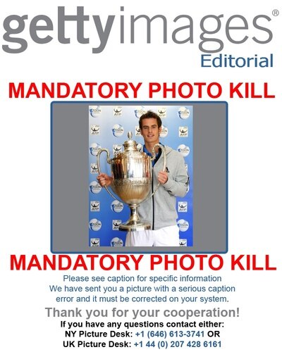 ATTENTION EDITORS: MANDATORY PHOTO KILL - PLEASE REMOVE THIS IMAGE FROM YOUR ARCHIVELONDON, UNITED KINDGOM - MAY 04: Andy Murray poses with the trophy during the AEGON Championship Announcement at Queens Club on May 4, 2010 in London, England. <br /><br /><span class="help">(Photo by Tom Dulat/Getty Images for LTA)</span>