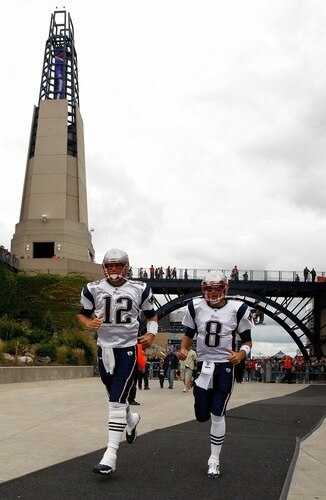 FOXBORO, MA - SEPTEMBER 12: Quarterbacks Tom Brady #12 and Brian Hoyer #8 of the New England Patriots run onto the field before the NFL season opener against the Cincinnati Bengals at Gillette Stadium on September 12, 2010 in Foxboro, Massachusetts. <br /><br /><span class="help">(Photo by Jim Rogash/Getty Images)</span>
