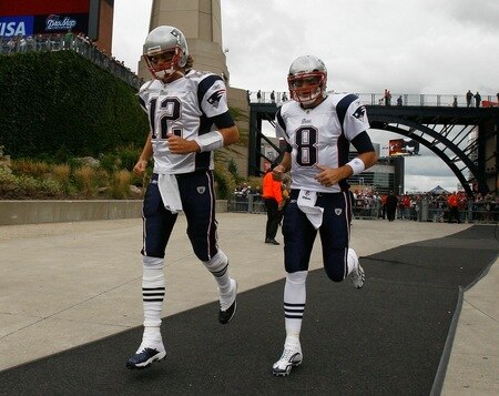 FOXBORO, MA - SEPTEMBER 12: Quarterbacks Tom Brady #12 and Brian Hoyer #8 of the New England Patriots run onto the field before the NFL season opener against the Cincinnati Bengals at Gillette Stadium on September 12, 2010 in Foxboro, Massachusetts. <br /><br /><span class="help">(Photo by Jim Rogash/Getty Images)</span>