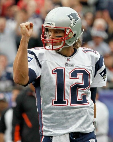 FOXBORO, MA - SEPTEMBER 12: Quarterback Tom Brady #12 reacts after teammate Wes Welker #83 scored a touchdown in the first quarter during the NFL season opener against the Cincinnati Bengals at Gillette Stadium on September 12, 2010 in Foxboro, Massachusetts. <br /><br /><span class="help">(Photo by Jim Rogash/Getty Images)</span>