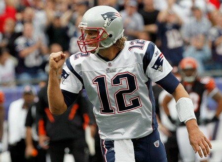 FOXBORO, MA - SEPTEMBER 12: Quarterback Tom Brady #12 reacts after teammate Wes Welker #83 scored a touchdown in the first quarter during the NFL season opener against the Cincinnati Bengals at Gillette Stadium on September 12, 2010 in Foxboro, Massachusetts. <br /><br /><span class="help">(Photo by Jim Rogash/Getty Images)</span>