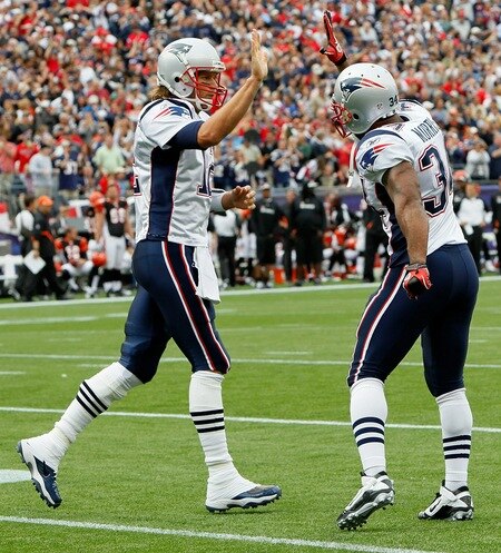 FOXBORO, MA - SEPTEMBER 12: Quarterback Tom Brady #12 of the New England Patriots celebrates with teammate Sammy Morris #34 during a the NFL season opener against the Cincinnati Bengals at Gillette Stadium on September 12, 2010 in Foxboro, Massachusetts. <br /><br /><span class="help">(Photo by Jim Rogash/Getty Images)</span>
