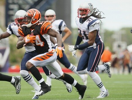 FOXBORO, MA - SEPTEMBER 12:  Adam Jones #24 of the Cincinnati Bengals tries to avoid Kyle Arrington #27 and Brandon Meriweather #31 of the New England Patriots during the NFL season opener on September 12, 2010 at Gillette Stadium in Foxboro, Massachusetts.  <br /><br /><span class="help">(Photo by Elsa/Getty Images)</span>
