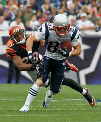 FOXBORO, MA - SEPTEMBER 12:  Wes Welker #83 of the New England Patriots gains yardage despite the defense of Leon Hall #29 of the Cincinnati Bengals during during the NFL season opener at Gillette Stadium on September 12, 2010 in Foxboro, Massachusetts. <br /><br /><span class="help">(Photo by Jim Rogash/Getty Images)</span>