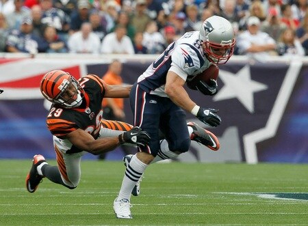FOXBORO, MA - SEPTEMBER 12:  Wes Welker #83 of the New England Patriots gains yardage despite the defense of Leon Hall #29 of the Cincinnati Bengals during during the NFL season opener at Gillette Stadium on September 12, 2010 in Foxboro, Massachusetts. <br /><br /><span class="help">(Photo by Jim Rogash/Getty Images)</span>