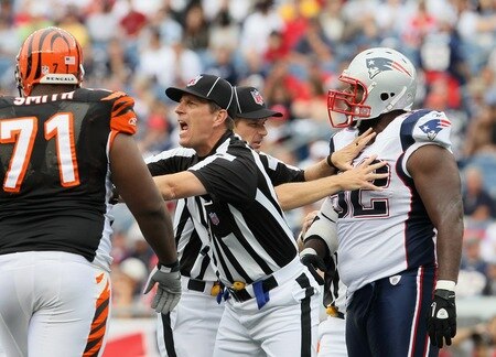 FOXBORO, MA - SEPTEMBER 12:  The officiasl break up a scuffle between Andre Smith #71 of the Cincinnati Bengals and Gerard Warren #92 of the New England Patriots during the NFL season opener on September 12, 2010 at Gillette Stadium in Foxboro, Massachusetts. The Patriots defeated the Bengals 38-24.  <br /><br /><span class="help">(Photo by Elsa/Getty Images)</span>