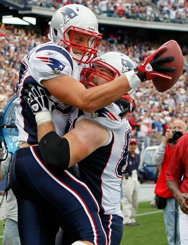 FOXBORO, MA - SEPTEMBER 12:  Rob Gronkowski #87 of the New England Patriots celebrates his touchdown catch with teammate Dan Connolly #63 in the second half against the Cincinnati Bengals during during the NFL season opener at Gillette Stadium on September 12, 2010 in Foxboro, Massachusetts. The Patriots won 38-24. <br /><br /><span class="help">(Photo by Jim Rogash/Getty Images)</span>