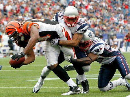 FOXBORO, MA - SEPTEMBER 12:  Jonathan Wilhite #24 and James Sanders #36 of the New England Patriots stop Jermaine Gresham #84 of the Cincinnati Bengals at the goal line during the NFL season opener at Gillette Stadium on September 12, 2010 in Foxboro, Massachusetts. The Patriots won 38-24. <br /><br /><span class="help">(Photo by Jim Rogash/Getty Images)</span>
