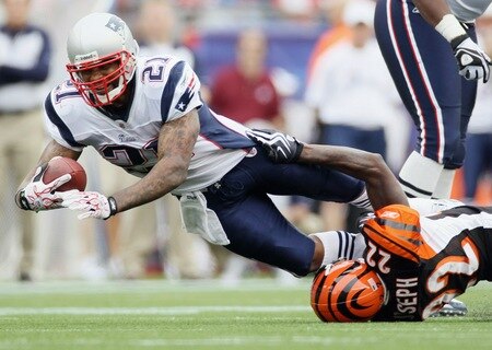 FOXBORO, MA - SEPTEMBER 12:  Fred Taylor #21 of the New England Patriots is tackled by Johnathan Joseph #22 of the Cincinnati Bengals during the NFL season opener on September 12, 2010 at Gillette Stadium in Foxboro, Massachusetts. The Patriots defeated the Bengals 38-24.  <br /><br /><span class="help">(Photo by Elsa/Getty Images)</span>
