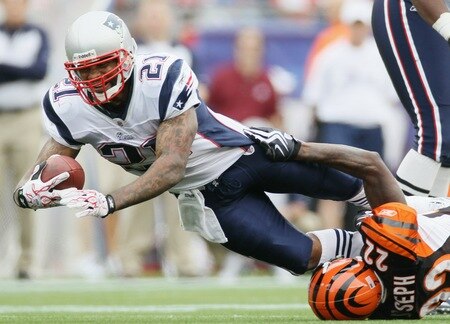 FOXBORO, MA - SEPTEMBER 12:  Fred Taylor #21 of the New England Patriots is tackled by Johnathan Joseph #22 of the Cincinnati Bengals during the NFL season opener on September 12, 2010 at Gillette Stadium in Foxboro, Massachusetts. The Patriots defeated the Bengals 38-24.  <br /><br /><span class="help">(Photo by Elsa/Getty Images)</span>