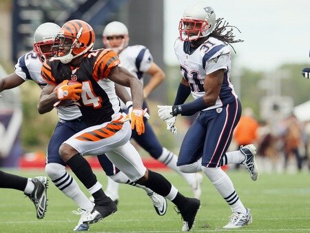 FOXBORO, MA - SEPTEMBER 12:  Adam Jones #24 of the Cincinnati Bengals tries to avoid Kyle Arrington #27 and Brandon Meriweather #31 of the New England Patriots during the NFL season opener on September 12, 2010 at Gillette Stadium in Foxboro, Massachusetts.  <br /><br /><span class="help">(Photo by Elsa/Getty Images)</span>