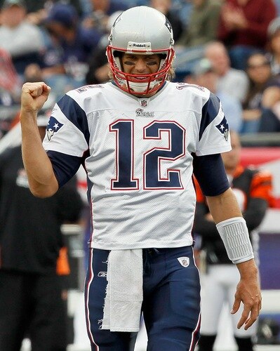 FOXBORO, MA - SEPTEMBER 12:  Tom Brady #12 of the New England Patriots reacts to a touchdown in the second half  during the NFL season opener against the Cincinnati Bengals at Gillette Stadium on September 12, 2010 in Foxboro, Massachusetts. <br /><br /><span class="help">(Photo by Jim Rogash/Getty Images)</span>