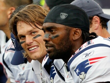FOXBORO, MA - SEPTEMBER 12: Quarterback Tom Brady #12 and Randy Moss #81 of the New England Patriots take a breather on the bench during the NFL season opener against the Cincinnati Bengals at Gillette Stadium on September 12, 2010 in Foxboro, Massachusetts. <br /><br /><span class="help">(Photo by Jim Rogash/Getty Images)</span>