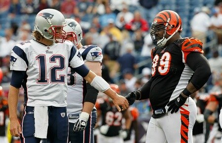 FOXBORO, MA - SEPTEMBER 12: Quarterbacks Tom Brady #12 of the New England Patriots shakes hands with Tank Johnson #99 of the Cincinnati Bengals during a the NFL season opener against the Cincinnati Bengals at Gillette Stadium on September 12, 2010 in Foxboro, Massachusetts. <br /><br /><span class="help">(Photo by Jim Rogash/Getty Images)</span>