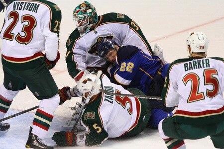 ST. LOUIS - SEPTEMBER 24: Brad Boyes #22 of the St. Louis Blues runs into Josh Harding #37 of the Minnesota Wild during a pre-season game at the Scottrade Center on September 24, 2010 in St. Louis, Missouri.  <br /><br /><span class="help">(Photo by Dilip Vishwanat/Getty Images)</span>