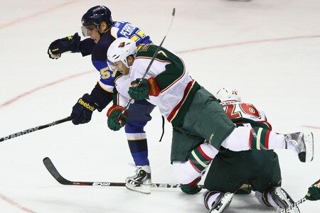 ST. LOUIS - SEPTEMBER 24: David Perron #57 of the St. Louis Blues looks to beat Matt Cullen #7 of  the Minnesota Wild to the ice during a pre-season game at the Scottrade Center on September 24, 2010 in St. Louis, Missouri.  <br /><br /><span class="help">(Photo by Dilip Vishwanat/Getty Images)</span>