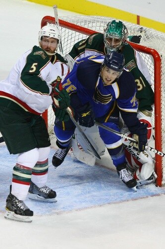 ST. LOUIS - SEPTEMBER 24: Brett Stone #76 of the St. Louis Blues looks for a pass against Greg Zanon #5 and Matt Hackett #31 both of the Minnesota Wild during a pre-season game at the Scottrade Center on September 24, 2010 in St. Louis, Missouri.  <br /><br /><span class="help">(Photo by Dilip Vishwanat/Getty Images)</span>