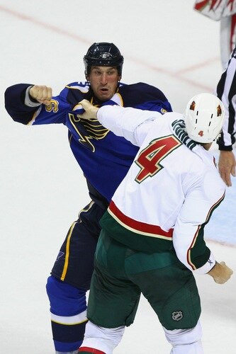 ST. LOUIS - SEPTEMBER 24: B.J. Crombeen #26 of the St. Louis Blues fights Clayton Stoner #4 of the Minnesota Wild during a pre-season game at the Scottrade Center on September 24, 2010 in St. Louis, Missouri.  <br /><br /><span class="help">(Photo by Dilip Vishwanat/Getty Images)</span>